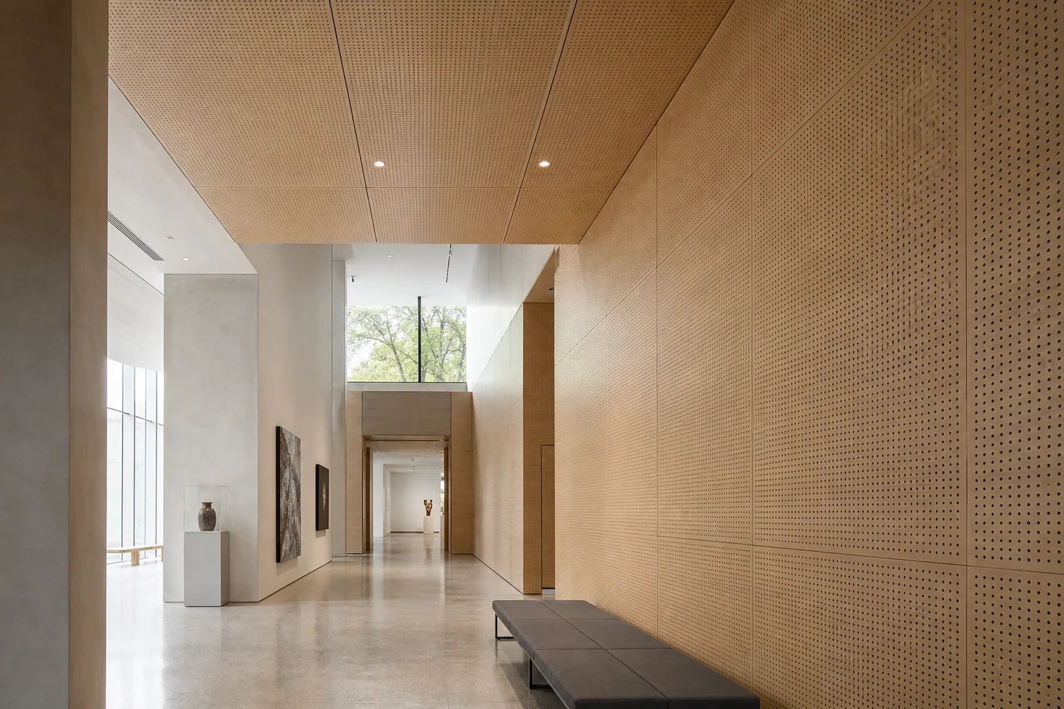 Contemporary museum gallery corridor with light oak perforated wood acoustic panels