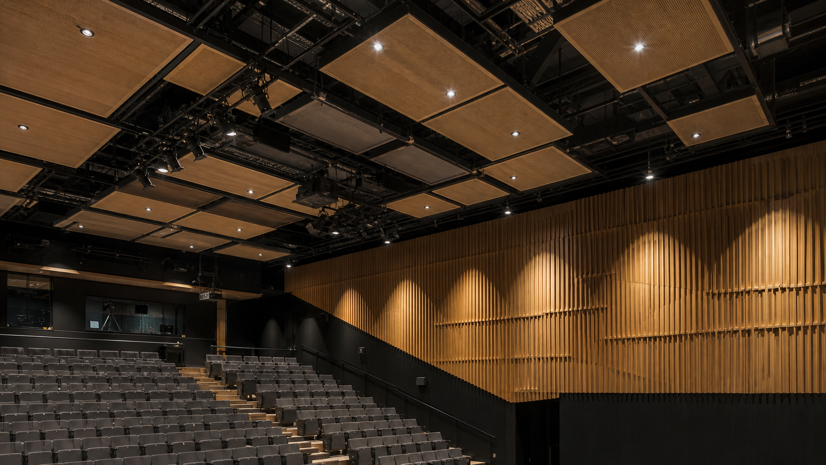 Suspended reflectors above a theatre audience